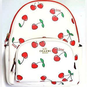 Coach Backpack with Heart Cherry Print. Includes a FREE PALETTE & LIP TRIO kit.